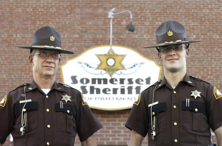 Eugene Cole, left, and his son David Cole, seen as Somerset County sheriff's deputies in 2007, entered law enforcement one after the other, with David Cole taking a job at the Kennebec County jail and his father joining the Somerset County Sheriff's Office in 2004. They graduated from the Maine State Police Academy a year apart, with Eugene Cole graduating in 2006 and his son in 2007.