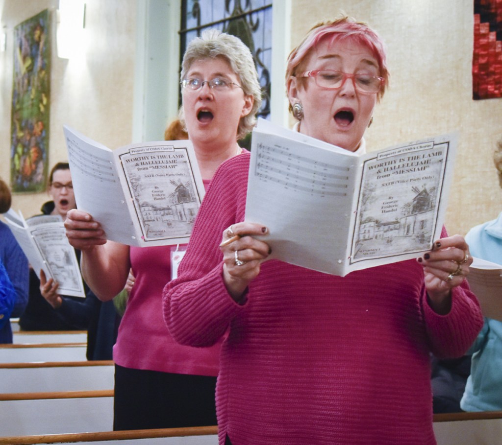 CODA Chorus board president Ruth Lund, left, of Readfield, and Su Locsin, of Augusta, sing the soprano part in George Frideric Handel's "Worthy of Lamb" at a rehearsal Monday at the Winthrop United Methodist Church. The chorus plans to present its 50th anniversary jubilee concert this Saturday at Hope Baptist Church in Manchester.