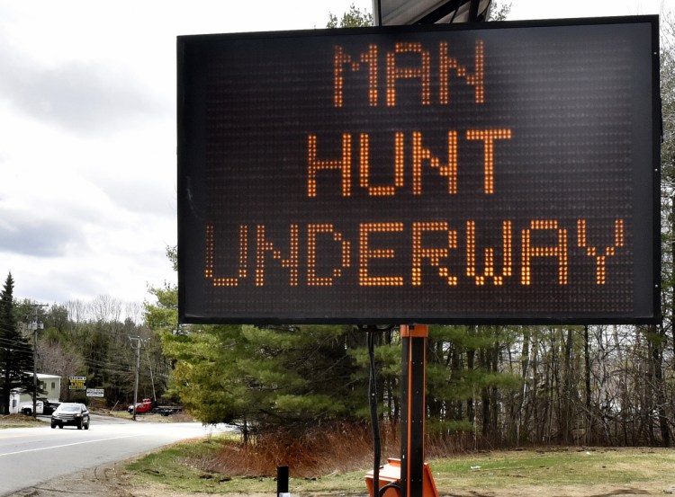 This large sign warned motorists Saturday on Skowhegan Road in Norridgewock that a manhunt was underway and to be alert. John Williams, suspected of fatally shooting a police officer, was arrested later in the day in Fairfield.