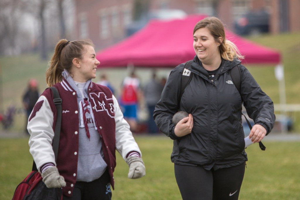 Photo by Jennifer Bechard 
 MCI's Allison Hughes, left, and her sister Meagan Hughes share a laugh at the Husky Throwdown on Saturday in Pittsfield.