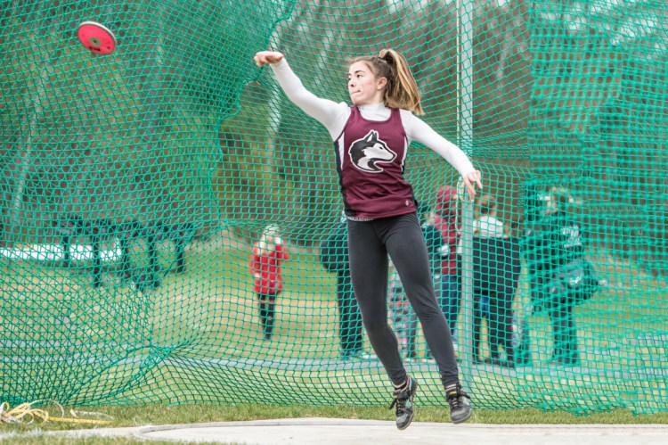 Photo by Jennifer Bechard 
 MCI's Allison Hughes throws the disc at the Husky Throwdown on Saturday in Pittsfield.