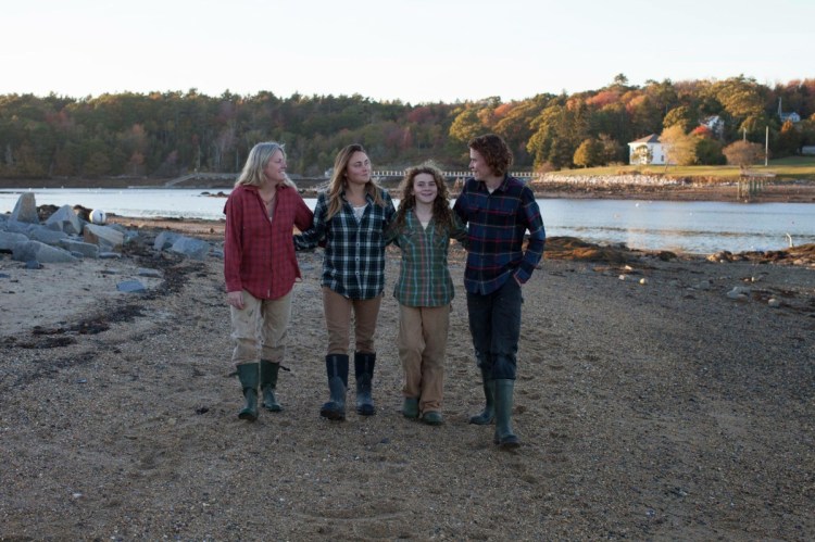 From left, Winterberry Farm owner Mary Perry and her children, Kenya Perry, Sage Whitehead and Gil Whitehead.