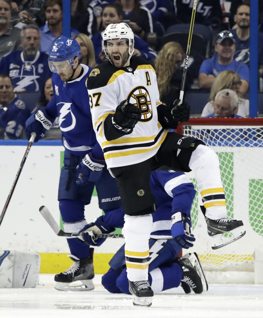 Boston center Patrice Bergeron (37) celebrates his goal against Tampa Bay during the second period of Game 1 of a second-round playoff series Saturday in Tampa, Florida.