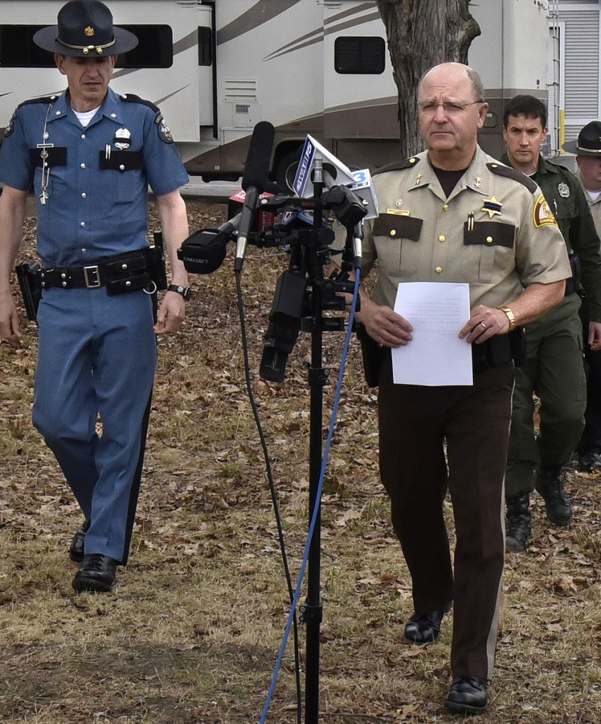 Somerset Sheriff Dale Lancaster, right, and Lt. Col. John Cote, left, of the Maine State Police spoke during a press conference on Saturday regarding search for murder suspect John Williams. Game warden Lt. Daniel Scott is at right.