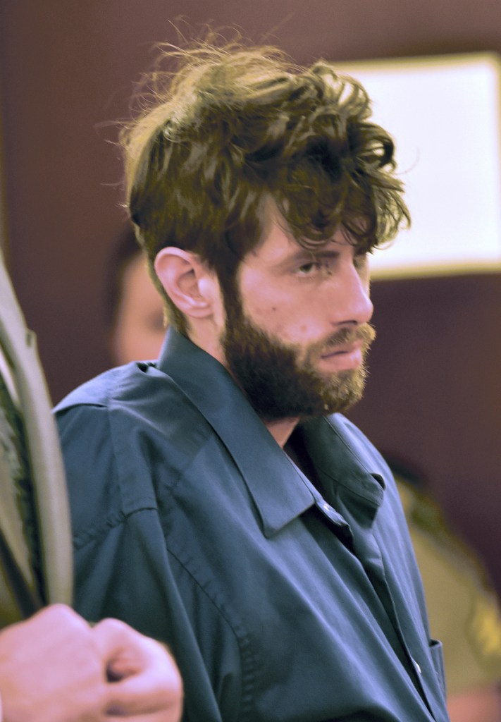 Defendant John D. Williams listens during a hearing at Capital Judicial Center in Augusta on Monday. Williams is charged with murder in the death of Somerset County Deputy Cpl. Eugene Cole on April 25.