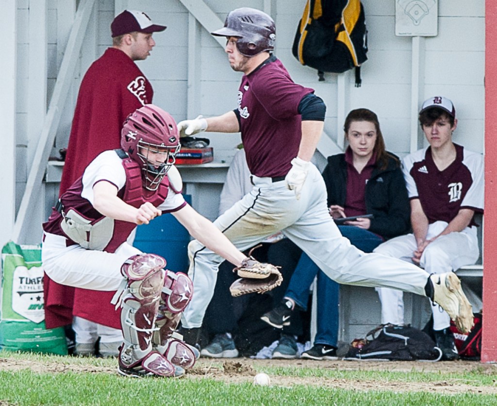 Richmond's Zach Small scampers home to score a run after Buckfield catcher Cole Merrill had difficulties with the throw to the plate during Monday's game in Buckfield.