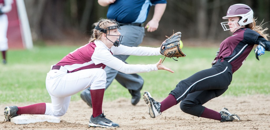 Sun Journal by Russ Dillingham
Buckfield's Maggie Bragg slides into second safely before Richmond's Caitlin Kendrick can put the tag on her during Monday's game in Buckfield.