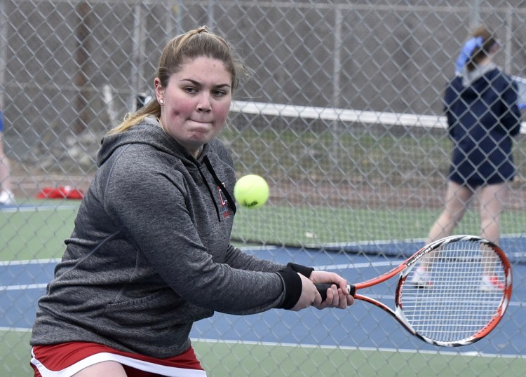 Cony's Sydney Hallee returns a shot against Messalonskee on Monday in Belgrade.