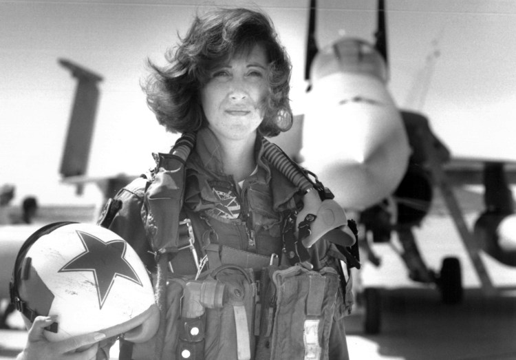 In this image provided by the U.S. Navy, Lt. Tammie Jo Shults, one of the first women to fly Navy tactical aircraft, poses in front of an F/A-18A with Tactical Electronics Warfare Squadron (VAQ) 34 in 1992. After leaving active duty in early 1993, Shults served in the Navy Reserve until 2001. Shults was the pilot of the Southwest plane that made an emergency landing on April 17, 2018, after an engine explosion.