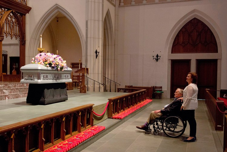Former President George H. W. Bush looks at the casket of his wife, former first lady Barbara Bush, with his daughter Dorothy "Doro" Bush Koch at St. Martin's Episcopal Church on Friday in Houston. Barbara Bush died on Tuesday, at the age of 92. 