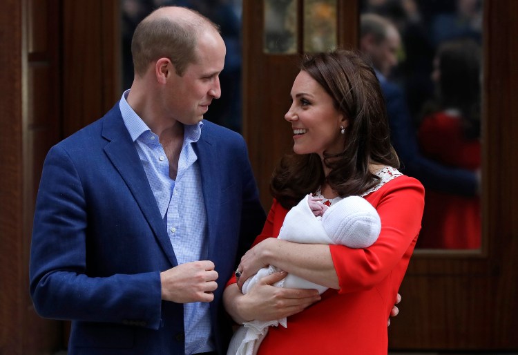 Britain's Prince William and Kate, Duchess of Cambridge pose for a photo with their newborn baby son as they leave the Lindo wing at St Mary's Hospital in London London, Monday. The Duchess of Cambridge gave birth Monday to a healthy baby boy — a third child for Kate and Prince William and fifth in line to the British throne. 