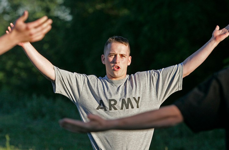 Army Pfc. Jon Schoenherr leads an exercise class outside an Army recruiting office in 2005.