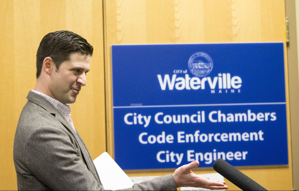 Waterville Mayor Nick Isgro evades reporters' questions about his recent social media controversy Tuesday night before a city budget meeting, calling the reporters "fake news." 