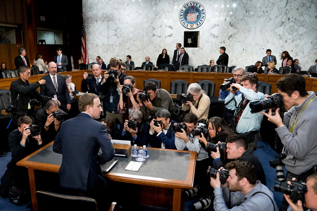 Facebook CEO Mark Zuckerberg returns from a break as he testifies before a joint hearing of the Senate Commerce and Judiciary committees on Capitol Hill on Tuesday.