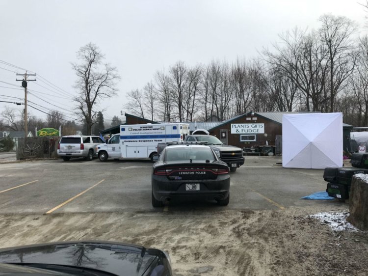 Lewiston Police are setting up several screens and blocking off the entire parking lot of Roak the Florist on Main Street after discovering the body of a woman near one of the greenhouses Wednesday morning. 