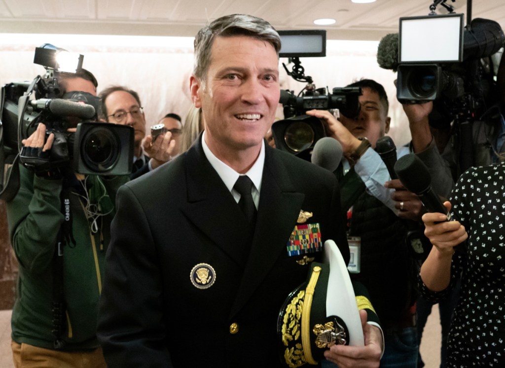Then-Rear Adm. Ronny Jackson, President Donald Trump's choice to be secretary of the Department of Veterans Affairs, leaves a Senate office building after meeting individually with some members of the committee that would vet him for the post, on Capitol Hill in Washington. Jackson withdrew from consideration as Veterans Affairs secretary. He said "false allegations" against him have become a distraction.