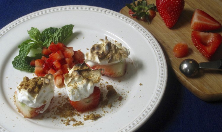 This spin on Baked Alaska uses fresh strawberries and crushed cookies instead of the traditional cake.
