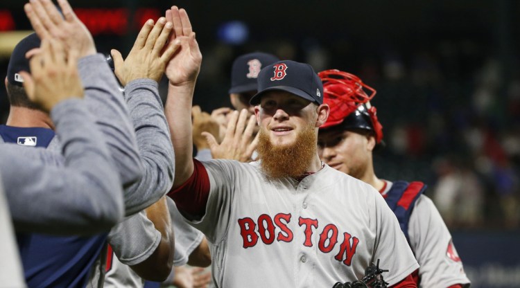 Craig Kimbrel celebrated with his Boston Red Sox teammates Saturday night after earning a save against the Texas Rangers – the 300th of his career – then was applauded with emotion in the clubhouse.