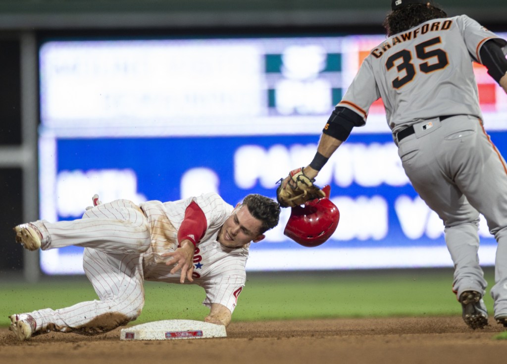 Scott Kingery of the Philadelphia Phillies is safe at second base with a steal Monday night as shortstop Brandon Crawford of the San Francisco Giants is late with the tag in the fourth inning of the Phils' 11-0 victory.