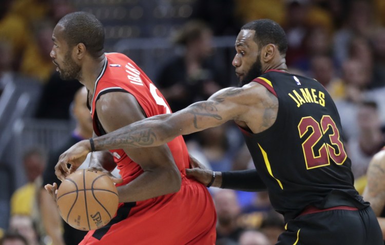 Cleveland's LeBron James strips the ball from Toronto's Serge Ibaka in the first half of Game 4 of their second-round playoff series Monday in Cleveland.