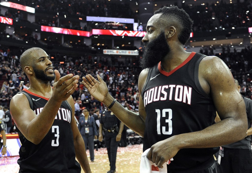 Houston's Chris Paul, right, and James Harden celebrate the Rockets win over the Utah Jazz on Tuesday in Houston.