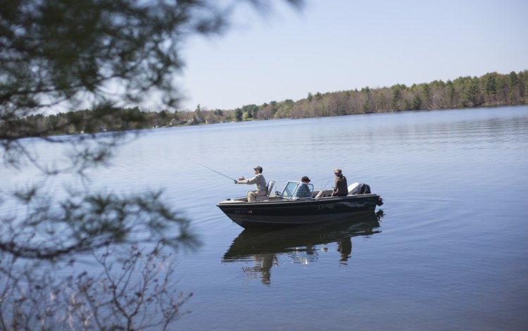 George Smith casts his line while fishing with his friend Ed Pineau on Webber Pond in Vassalboro on Wednesday. Smith, a longtime Kennebec Journal columnist and former director of the Sportsman's Alliance of Maine, was diagnosed with ALS about a year ago.