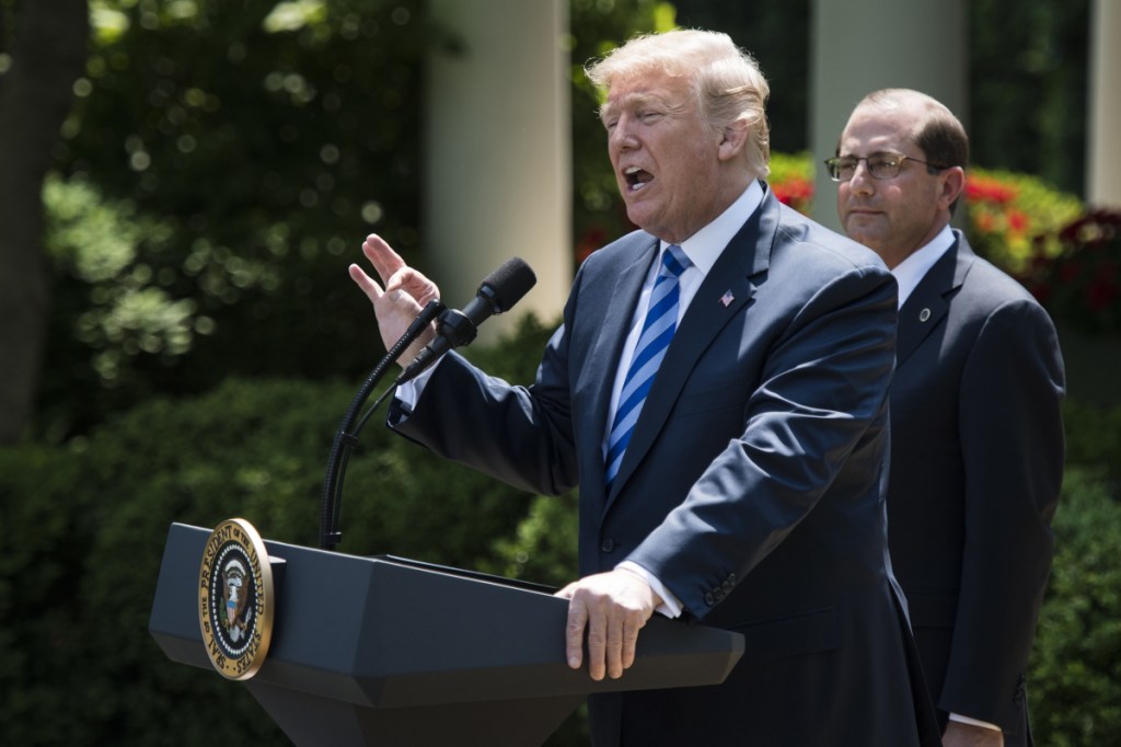President Trump speaks with Health and Human Services Secretary Alex Azar by his side in the Rose Garden of the White House on Friday. MUST CREDIT: Washington Post photo by Jabin Botsford