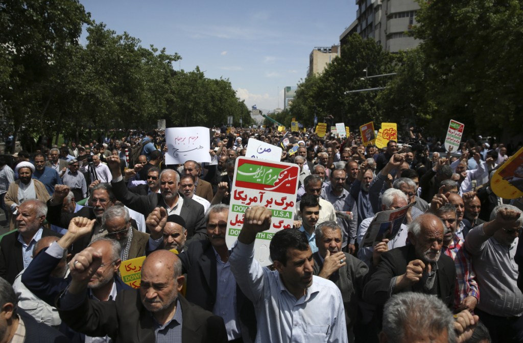 Iranian protesters chant slogans during an anti-U.S. gathering after their Friday prayers in Tehran, Iran. Thousands of Iranians took to the streets in cities across the country to protest President Trump's decision to pull out of the nuclear deal with world powers.