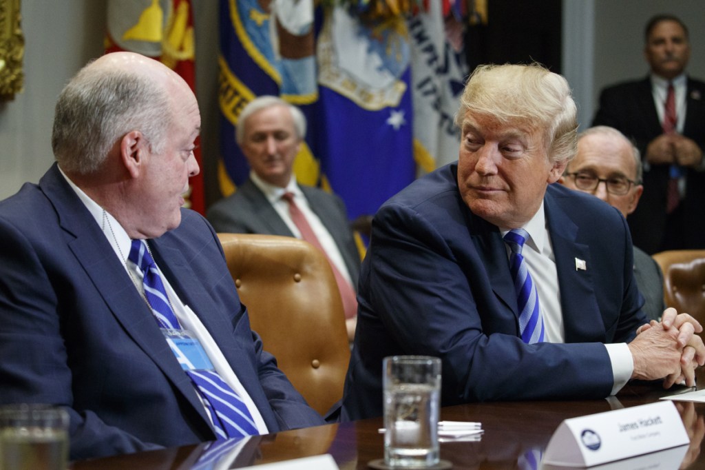 Ford CEO James Hackett talks to President Donald Trump during a meeting with automotive executives in the Roosevelt Room of the White House, Friday, May 11, 2018, in Washington. (AP Photo/Evan Vucci)