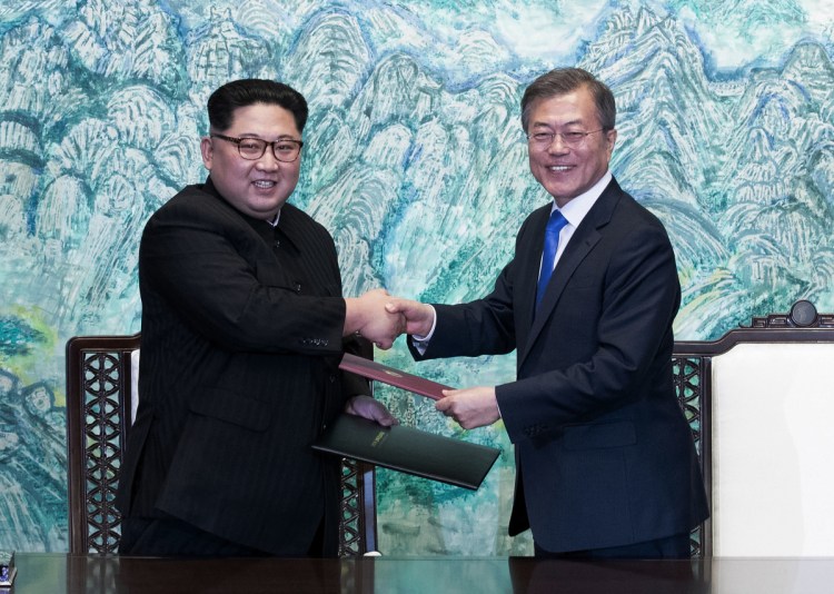 North Korean leader Kim Jong Un, left, and South Korean President Moon Jae-in shake hands in April after signing a joint statement at the border village of Panmunjom in the Demilitarized Zone, South Korea. A meeting planned for Wednesday between representatives of the two countries has been canceled.