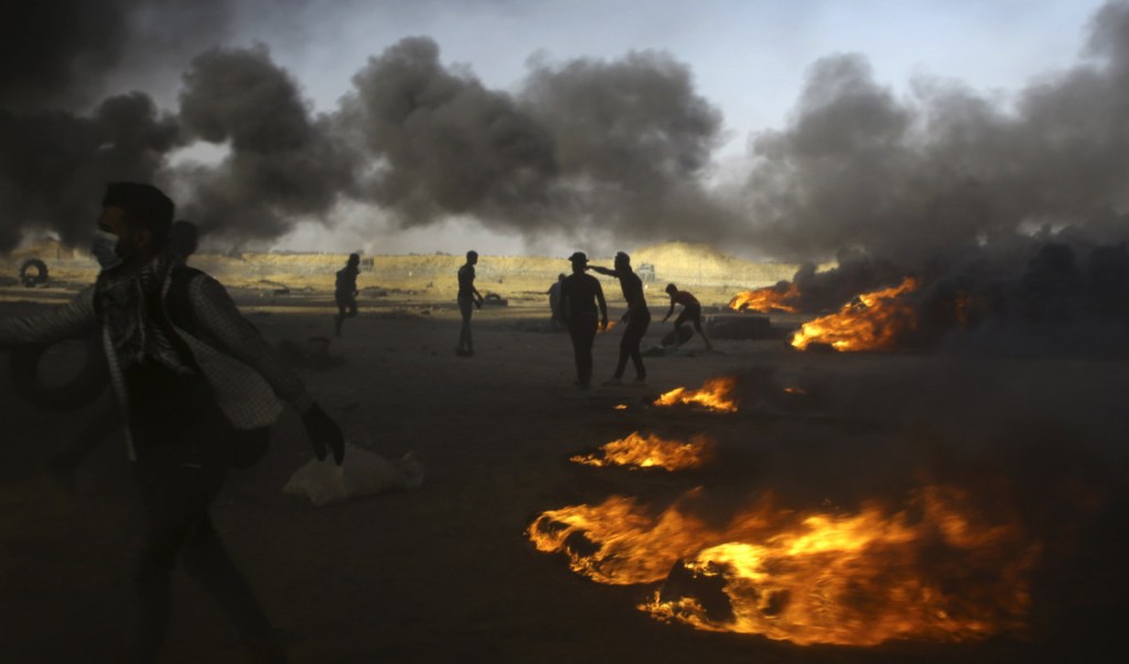 Palestinian protesters burn tires during a protest at the Gaza Strip's border with Israel on Tuesday.