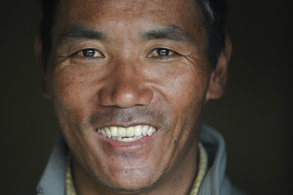 Nepalese veteran Sherpa guide Kami Rita, 48, scaled Mount Everest on Wednesday for the 22nd time, setting the record for most climbs of the world's highest mountain, officials said.