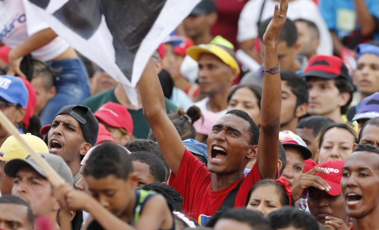 Supporters of Venezuela's President Nicolas Maduro attend his closing campaign rally in Caracas on Thursday. 