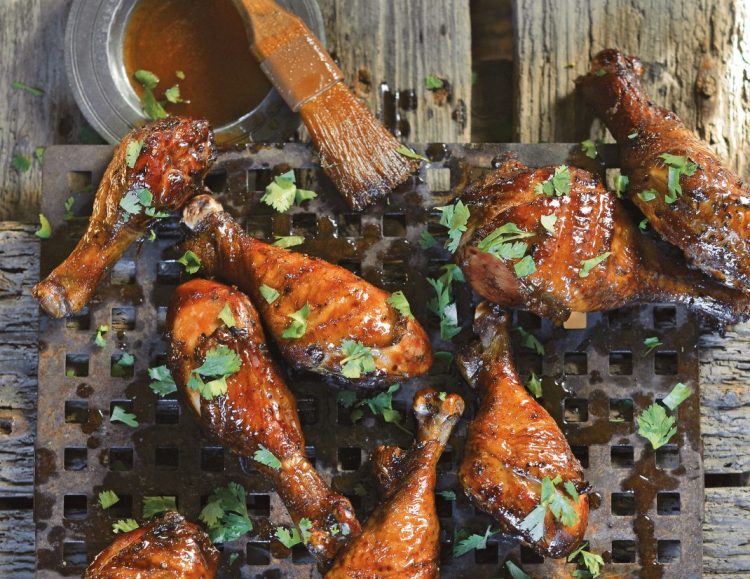 Maple-Sriracha chicken drumsticks only need 10 ingredients and are a simple summer grilling recipe from the  “Shakespeare of Barbecue": Steven Raichlen. 