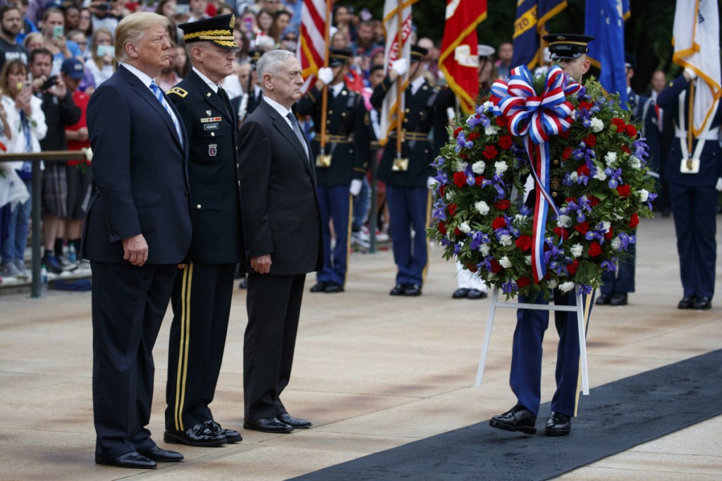 President Trump, Maj. Gen. Michael L. Howard, , center, and Secretary of Defense Jim Mattis participate in ceremonies Monday.