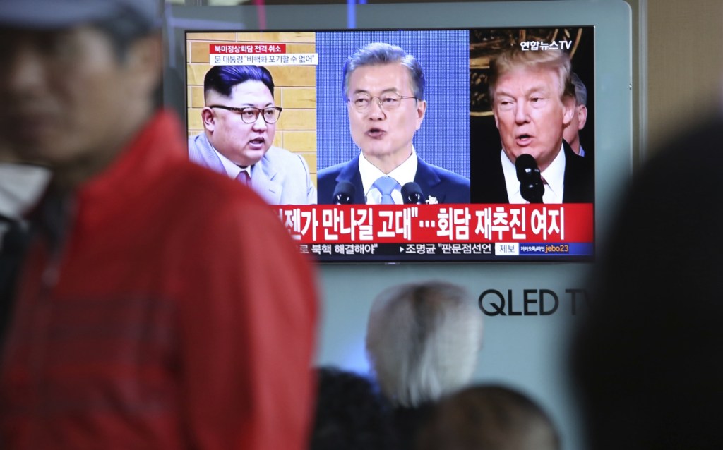 A TV screen shows images of President Trump, right, South Korean President Moon Jae-in and North Korean leader Kim Jong Un, left, during a news program at the Seoul Railway Station in Seoul, South Korea.