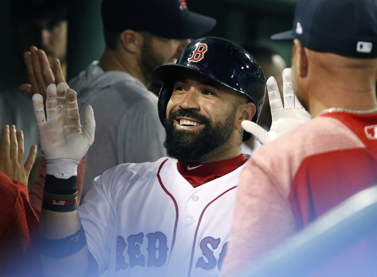 Boston catcher Sandy Leon smiles after his two-run home run during the eighth inning of Tuesday's game against Toronto in Boston.