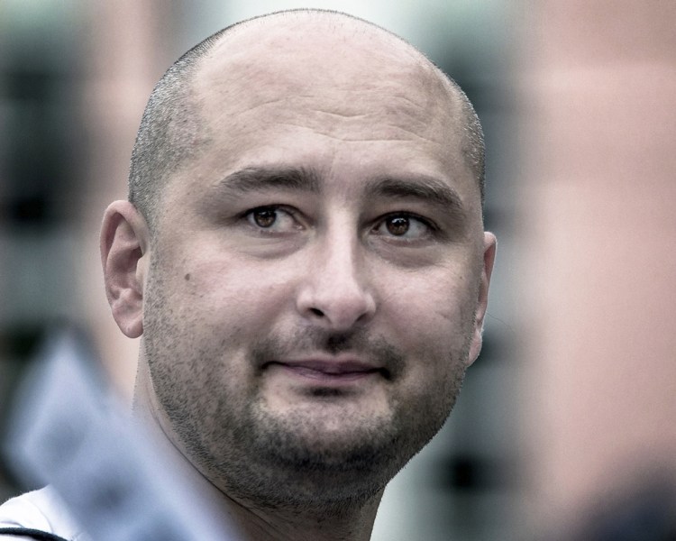 Arkady Babchenko, shown in a 2013 photo, was reported shot and killed Tuesday, but showws up at a news conference Wednesday very much alive. 