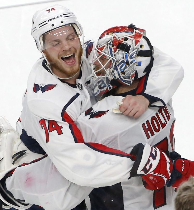 Capitals defenseman John Carlson, left, and goaltender Braden Holtby celebrate after Washington's 3-2 win over Vegas in Game 2 Wednesday.