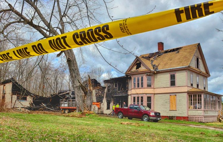 Damage is seen Tuesday at a large home at 10 West St. in Gardiner, a day after a fire broke out at the 128-year-old home. The cause of the fire remains under investigation.