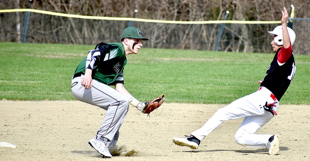 Spruce Mountain shortstop Nick Lombardi waits for the ball as Hall-Dale's Akira Warren slides into second base during a baseball game Wednesday at Griffin Field in Livermore Falls.