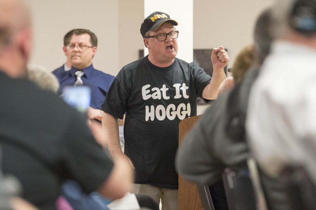 Hank Poirier speaks from a lectern April 17 proclaiming that "Eat it, Hogg" is not so bad during a City Council meeting in Waterville. Poirier was referring to Mayor Nick Isgro's controversial tweet that sparked an effort to recall Isgro from office.