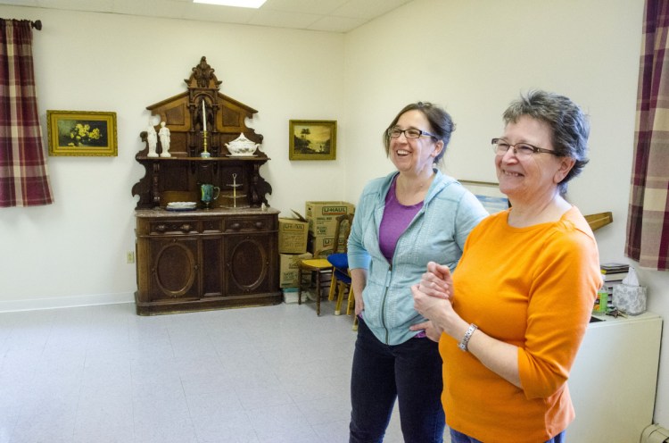 Sarah Miller, director of Bridging the Gap, left, and Betty Balderston, president of Emmanuel Lutheran Episcopal Church, talk about the where in the church Bridging the Gap could be located, pending Augusta Planning Board approval, during a tour Tuesday in the church in Augusta.