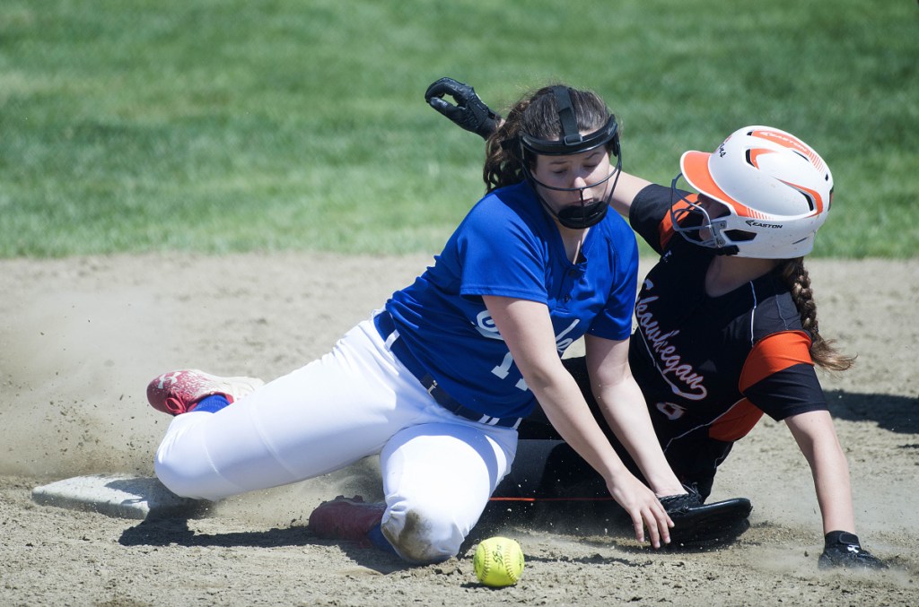 Skowhegan's Sydney Ames, right, slides safely into second base on a steal as Messalonskee shortstop Taylor Baker tries to handle the throw Saturday in Skowhegan.