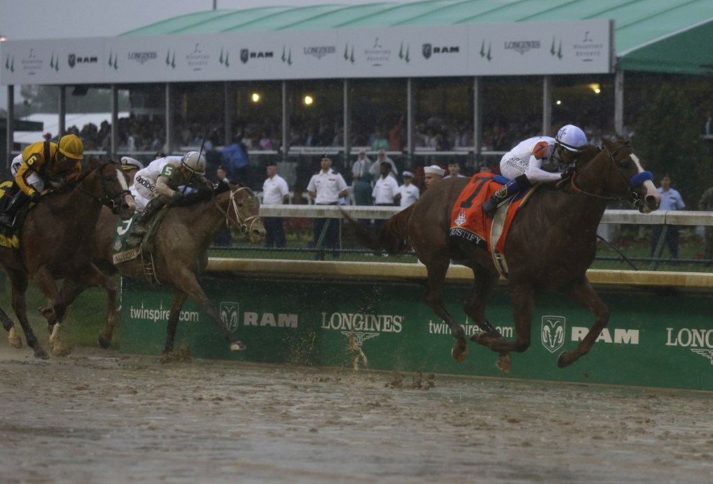 Mike Smith rides Justify to victory during the 144th running of the Kentucky Derby on Saturday at Churchill Downs in Louisville, Kentucky.