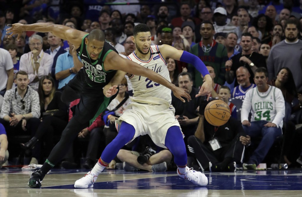 Boston's Al Horford, left, and Philadelphia's Ben Simmons chase the ball during the second half of Game 3 of a second-round playoff series Saturday in Philadelphia.