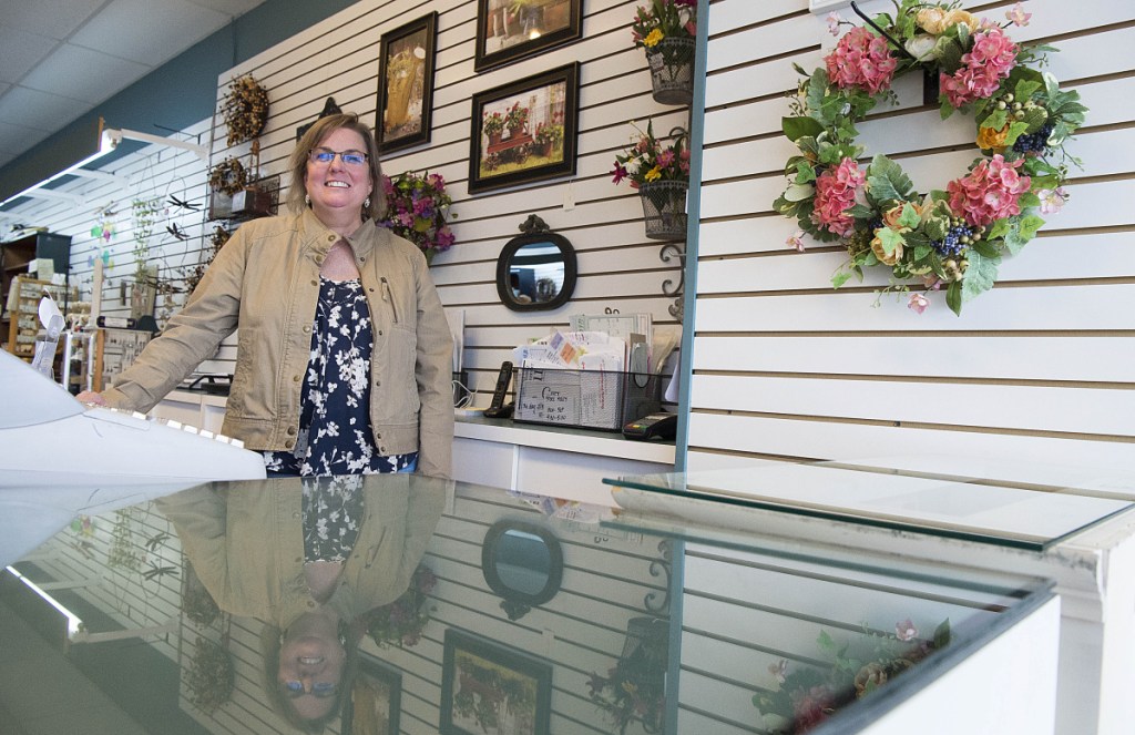 Paige Zirtidis, owner of Maine Made and More, stands for a portrait at the store's new location at The Concourse in downtown Waterville on Friday.