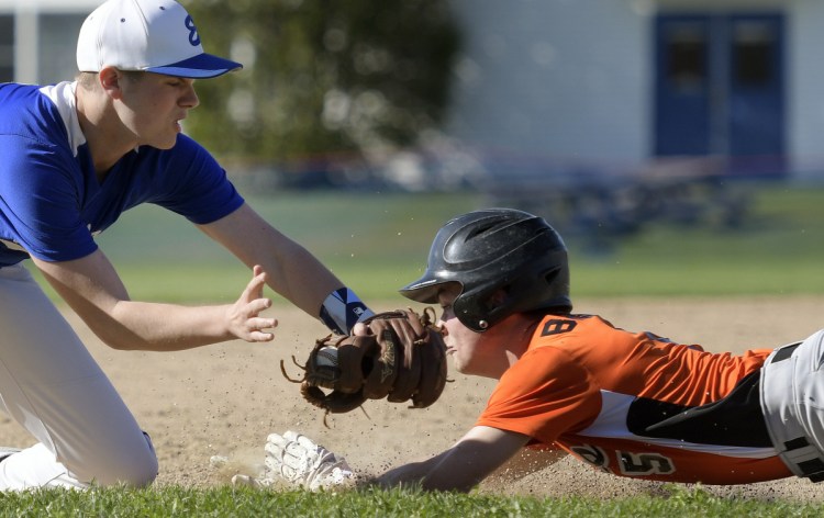Erskine's Caden Turcotte can't apply the tag on third to Gardiner's Kolton Brochu during a game Monday in South China.