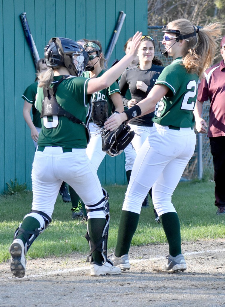 Winthrop catcher Hanna Caprara (left) celebrates the Ramblers' win over Monmouth with pitcher Layne Audet (right) on Monday in Winthrop.