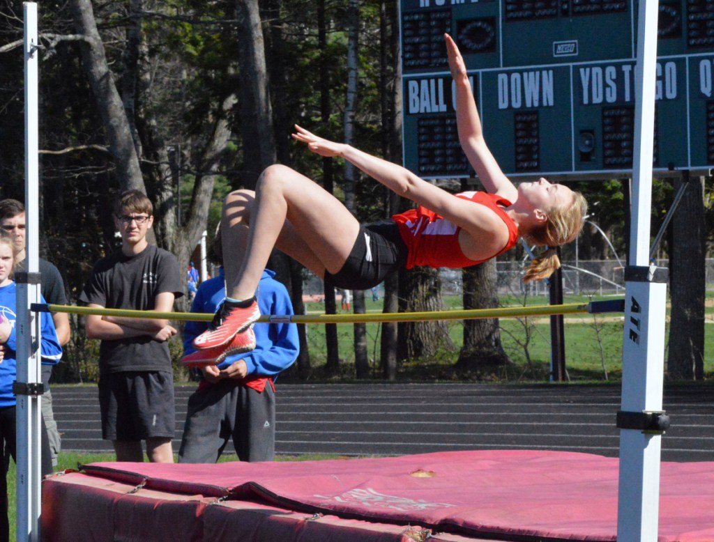 Cony's Tess Towle clears the bar in the high jump during a KVAC meet Monday.